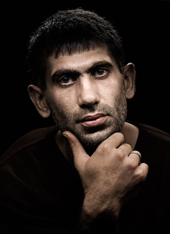 Portrait of an armenian | male, hand, stubble