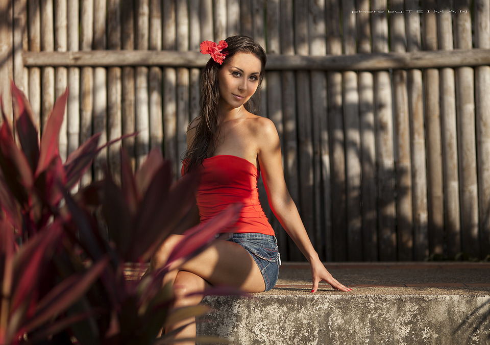 Pretty girl in red shirt | red shirt, pretty girl, fence, red bow