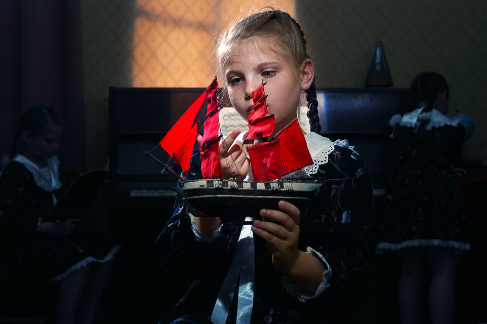 Child with toy ship | child, toy ship, dark