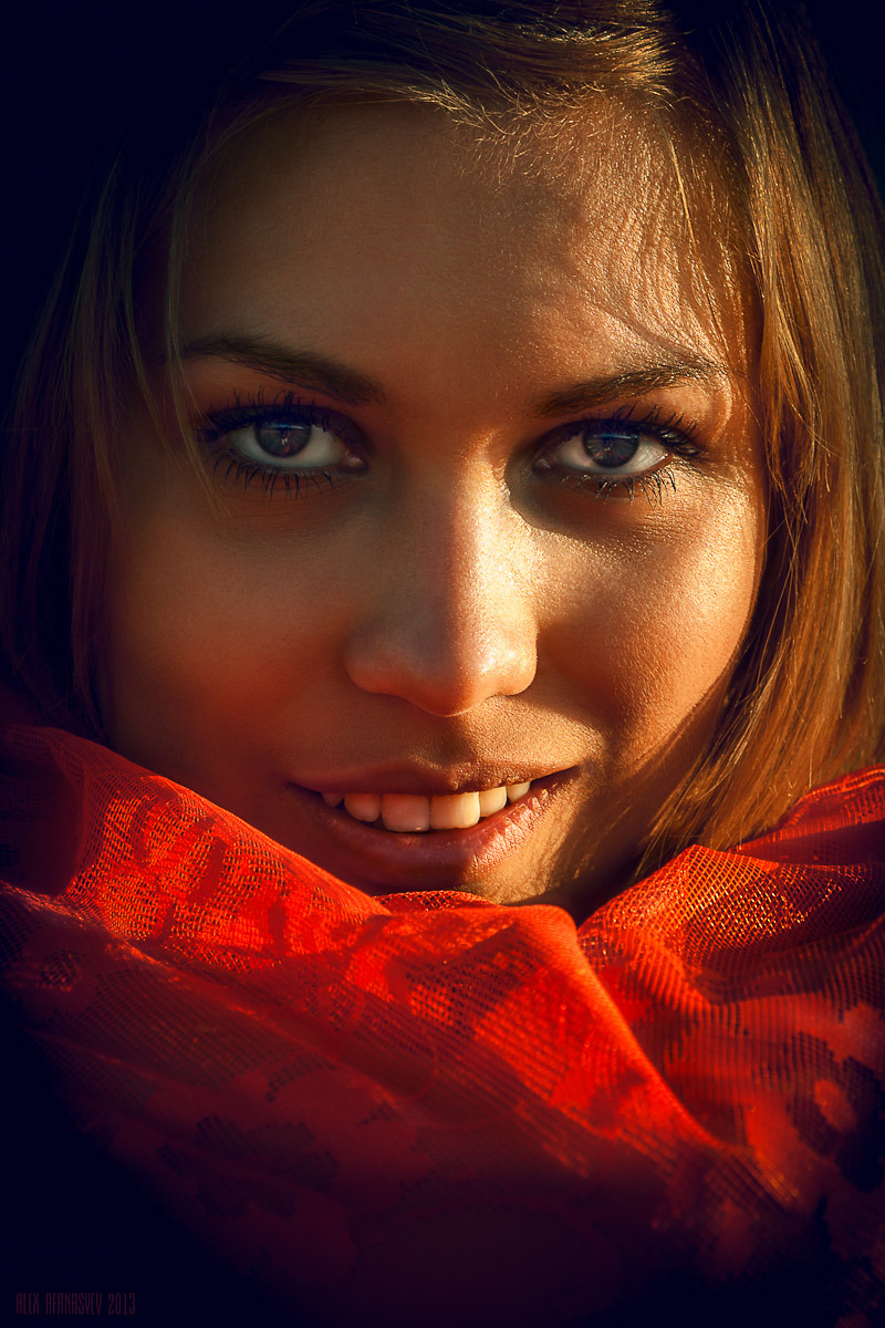 Girl shows her teeth | yellow teeth, light , shadow, red kerchief