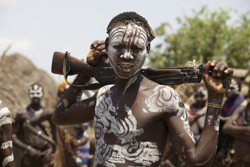 Weaponed man covered with war paint | weaponed man, war paint, negro, villiage