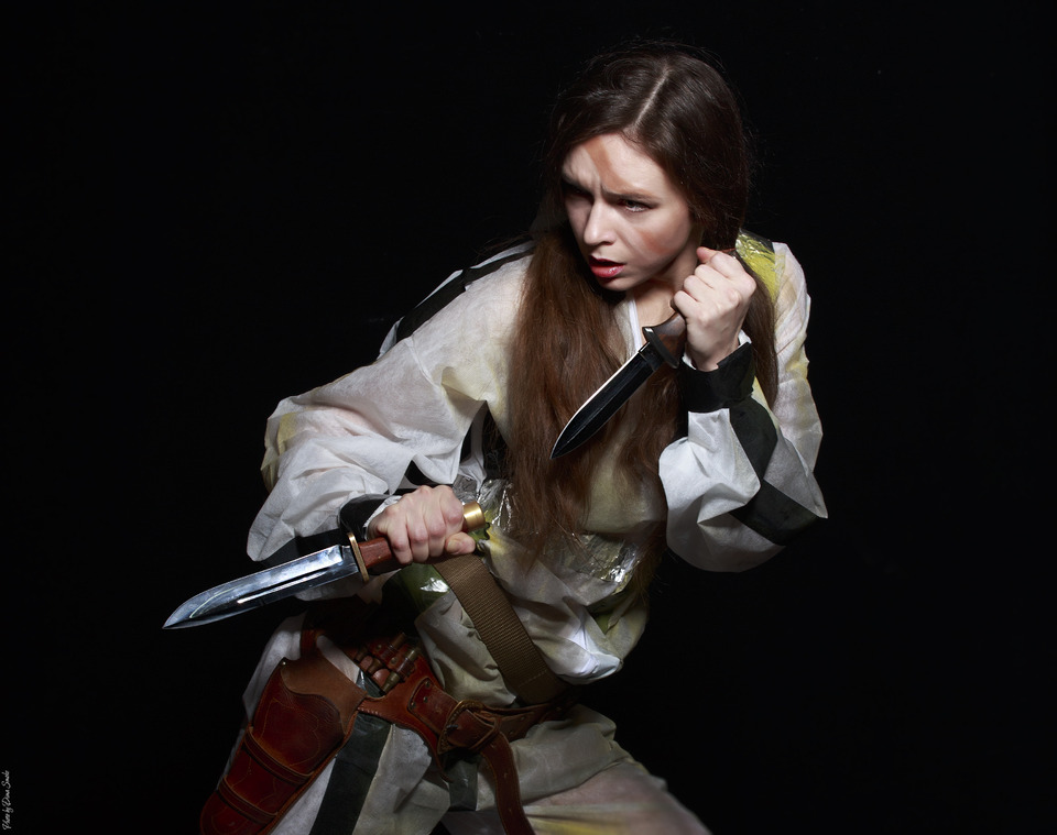 Girl with two daggers | portrait, model, girl, long hair, knifes, holster, face, make-up, black background, dagger
