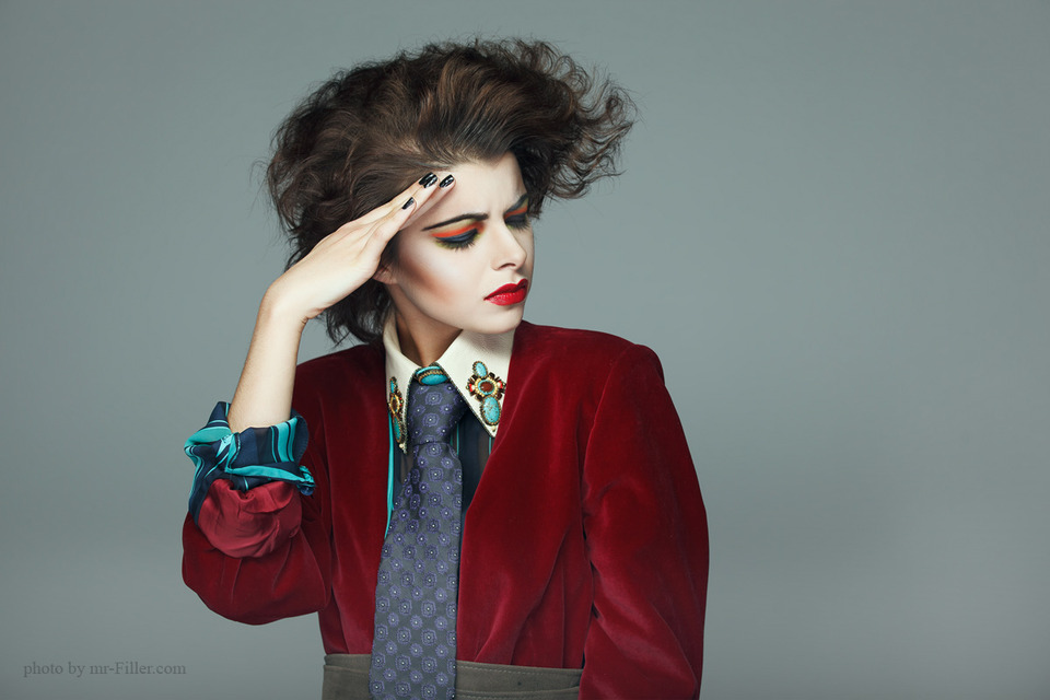 Sharp image of a model | portrait, model, make-up , radiant , red lipstick, hair-do, jacket, tie, nails, black