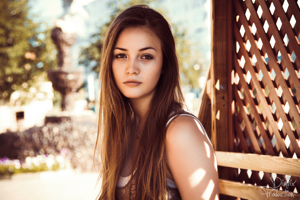 Teenage country girl posing outside | pose, environmental portrait, wooden fence, nature, summer, sunlight