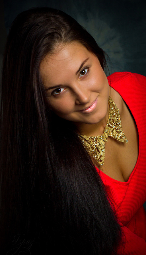 Beautiful girl in in red dress wears huge golden necklace | red dress, smile, golden necklace, smile, long hair, pink lipstick