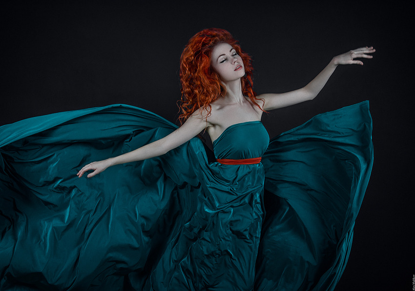 Portrait of a red-haired girl | portrait, girl, model, black background, light skin, red-haired , curls, blue dress, red belt, fly