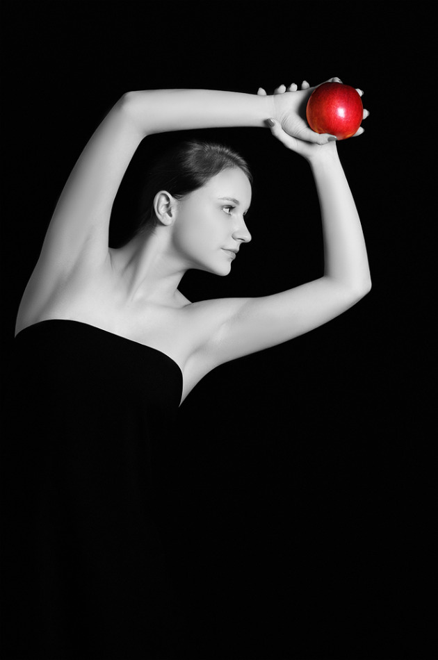 Black & white photo of a girl with an apple | portrait, model, girl, black & white, black background, natural, red , apple, face, brunette